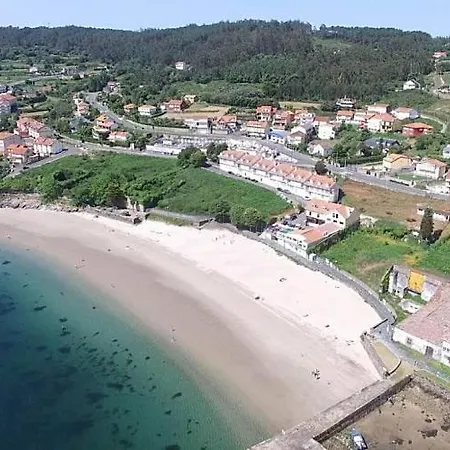 Playa De Quenxe Апартаменты Коркубион